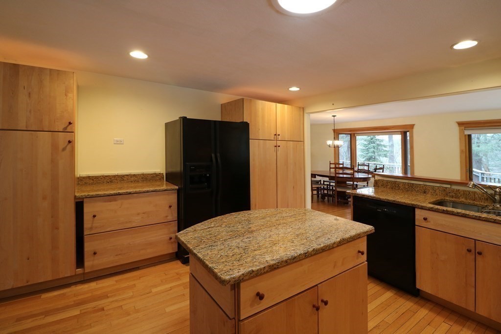 20 Under Pin Hill Road Harvard, MA 01451 - Photo 14 of 41 a kitchen with a refrigerator and countertop wooden cabinets