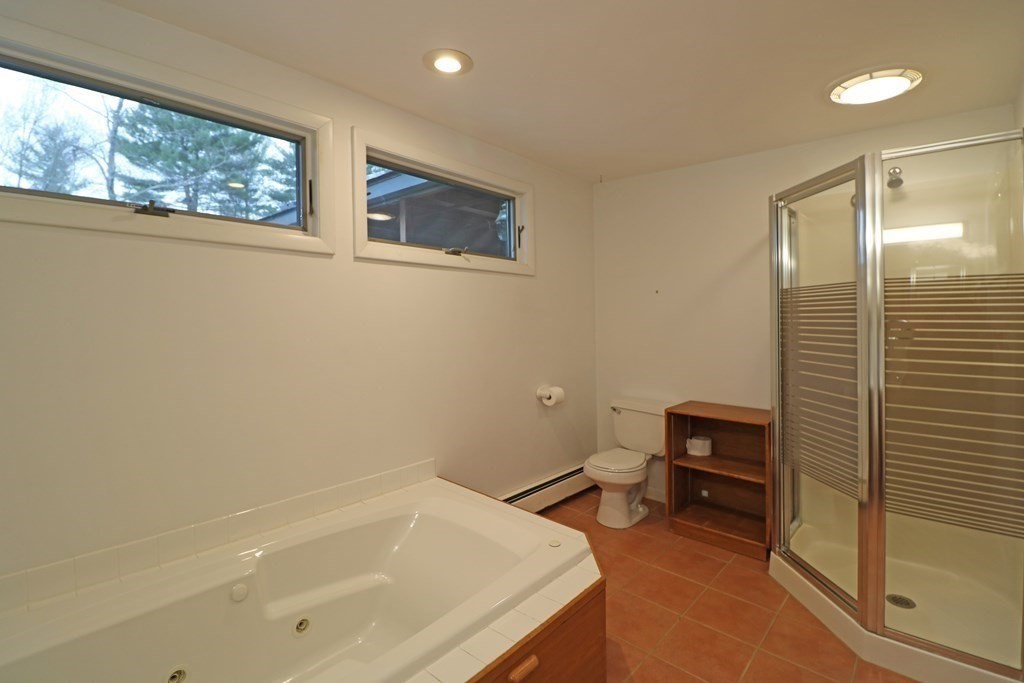 20 Under Pin Hill Road Harvard, MA 01451 - Photo 20 of 41 a bathroom with a tub and a sink