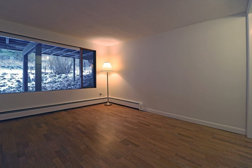 20 Under Pin Hill Road Harvard, MA 01451 - Photo 24 of 41 a view of an empty room with wooden floor and a window