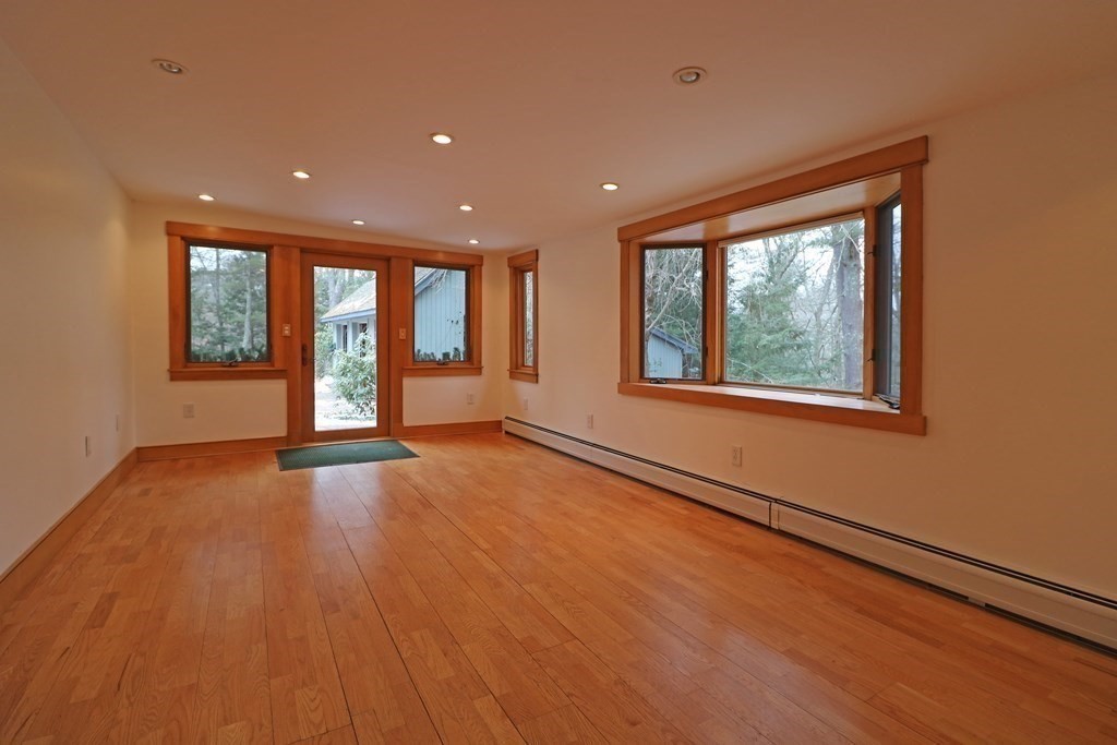 20 Under Pin Hill Road Harvard, MA 01451 - Photo 28 of 41 an empty room with wooden floor and windows