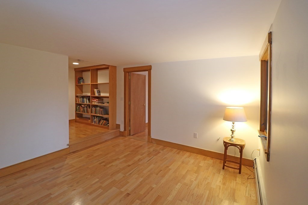 20 Under Pin Hill Road Harvard, MA 01451 - Photo 29 of 41 a view of a room with wooden floor and bench