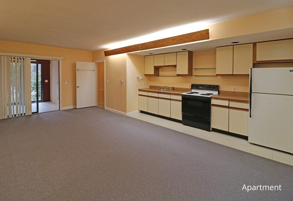 20 Under Pin Hill Road Harvard, MA 01451 - Photo 39 of 41 a kitchen with stainless steel appliances granite countertop a stove a sink and a refrigerator