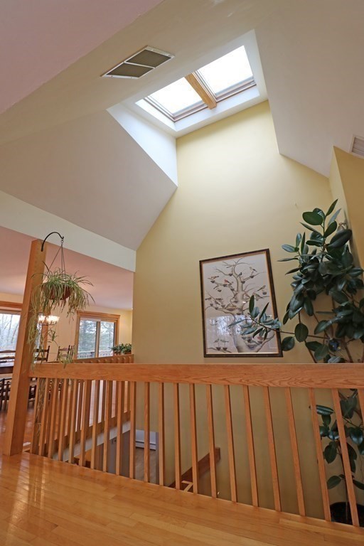 20 Under Pin Hill Road Harvard, MA 01451 - Photo 10 of 41 a view of a livingroom with wooden floor and stairs