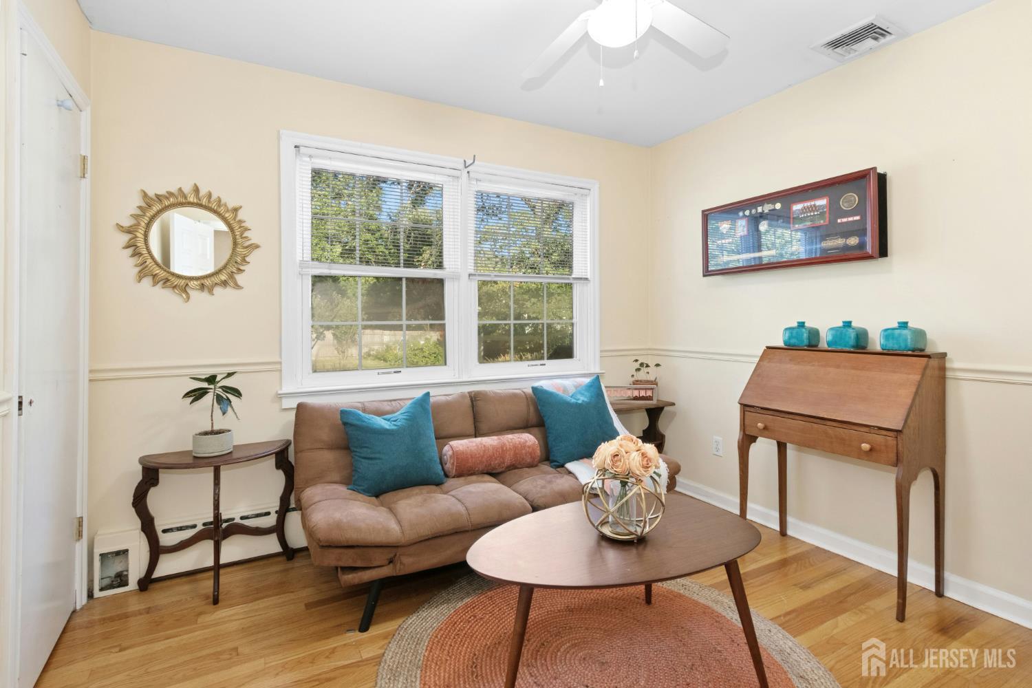 52 Brookside Terrace Clark, NJ 07066 - Photo 11 of 26 a living room with furniture a table and a large window