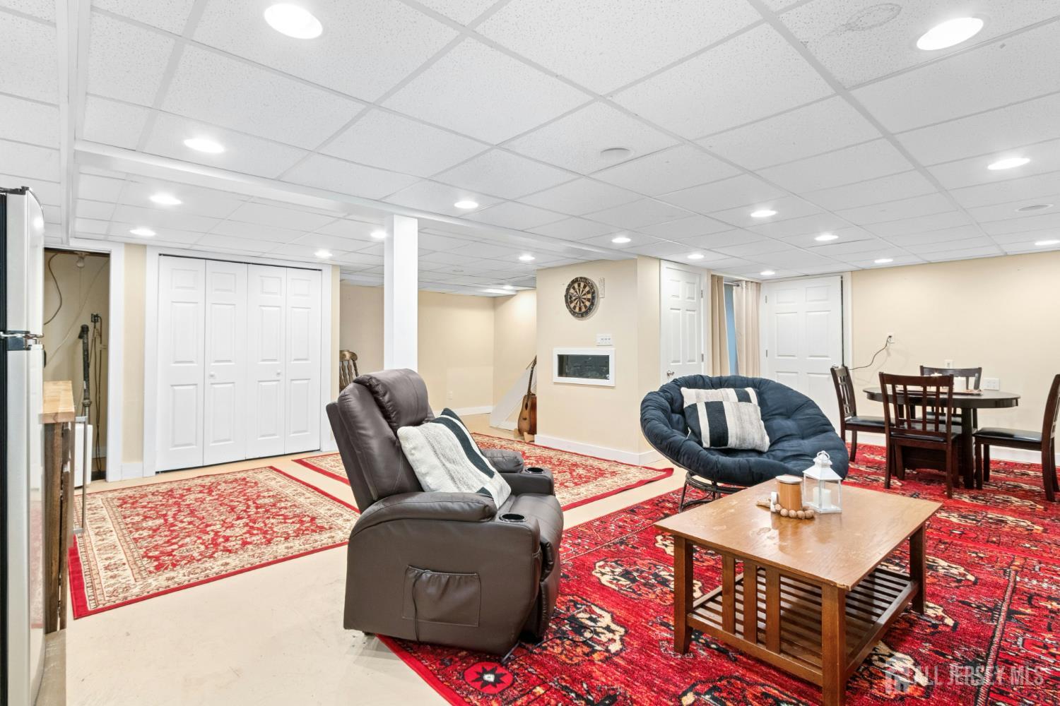 52 Brookside Terrace Clark, NJ 07066 - Photo 20 of 26 a living room with furniture a rug and a floor to ceiling window