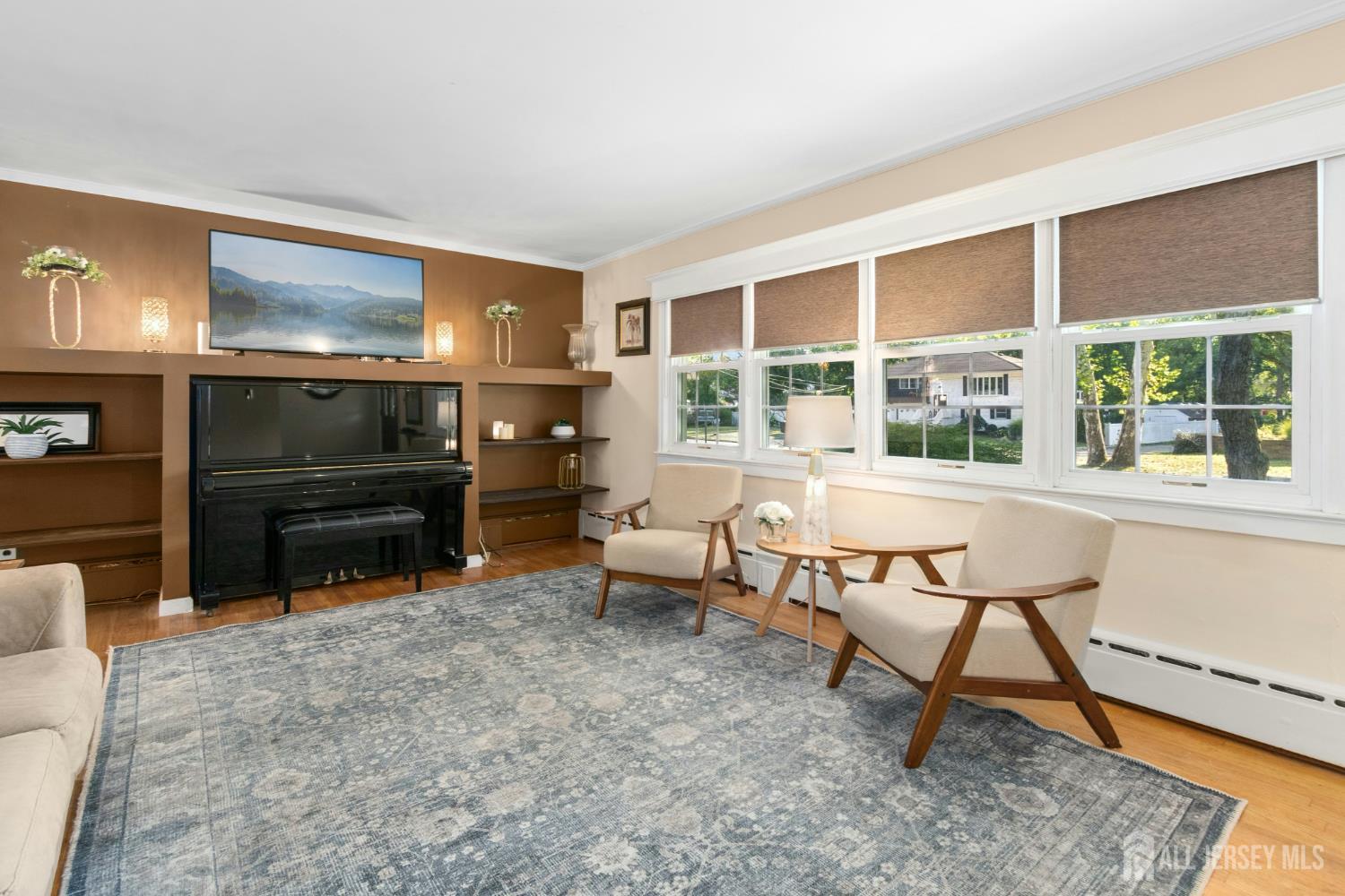 52 Brookside Terrace Clark, NJ 07066 - Photo 3 of 26 a living room with furniture a rug and a floor to ceiling window