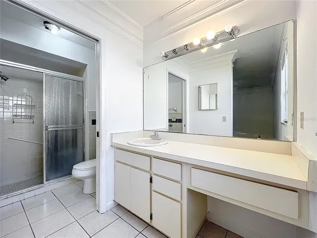 a bathroom with a shower and a sink