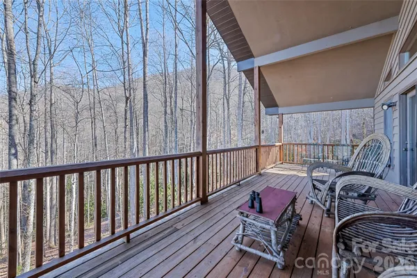 a view of a balcony with furniture