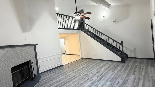 a view of an entryway with wooden floor