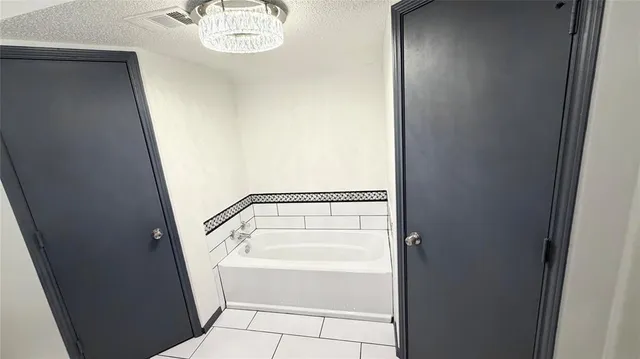 view of walk in closet with cabinet and entryway