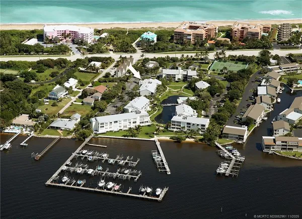 an aerial view of residential houses with outdoor space