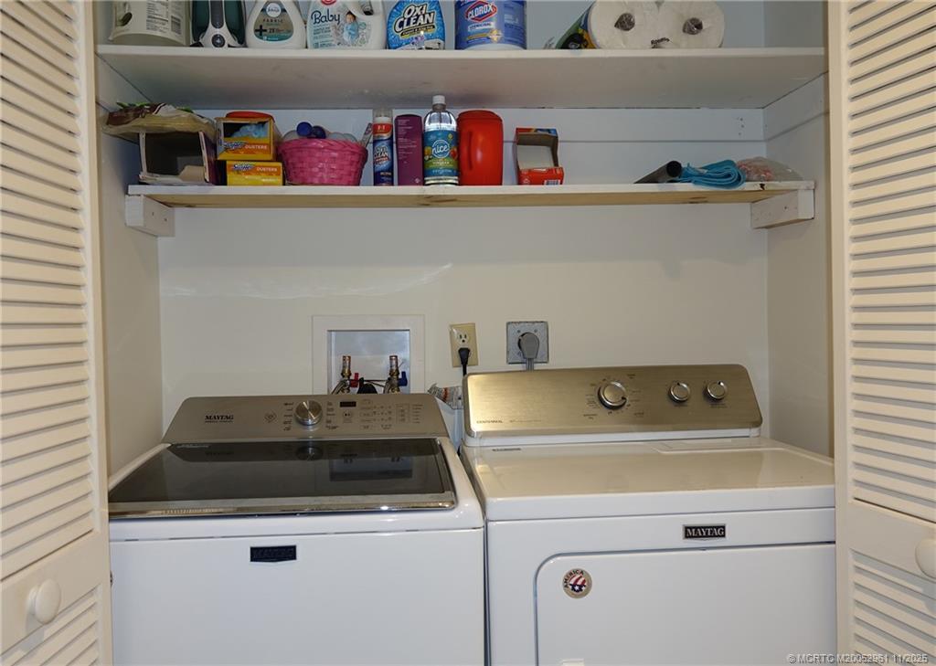 1550 Northeast Ocean Boulevard, Unit B101 Stuart, FL 34996 - Photo 14 of 32 a utility room with washer and dryer