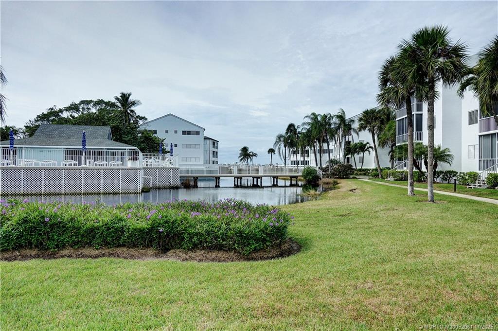 1550 Northeast Ocean Boulevard, Unit B101 Stuart, FL 34996 - Photo 21 of 32 a view of outdoor space with garden and trees