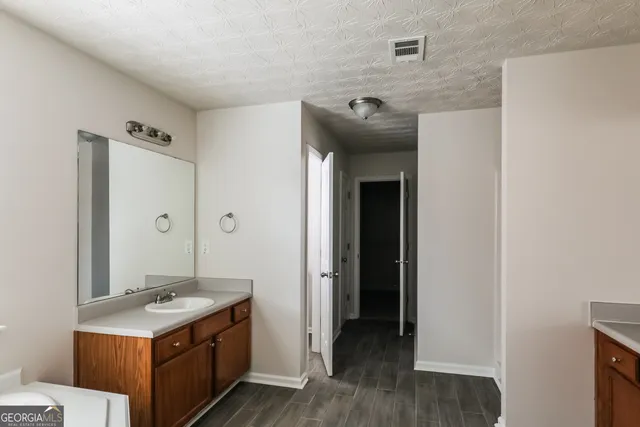 a hallway with washer and dryer