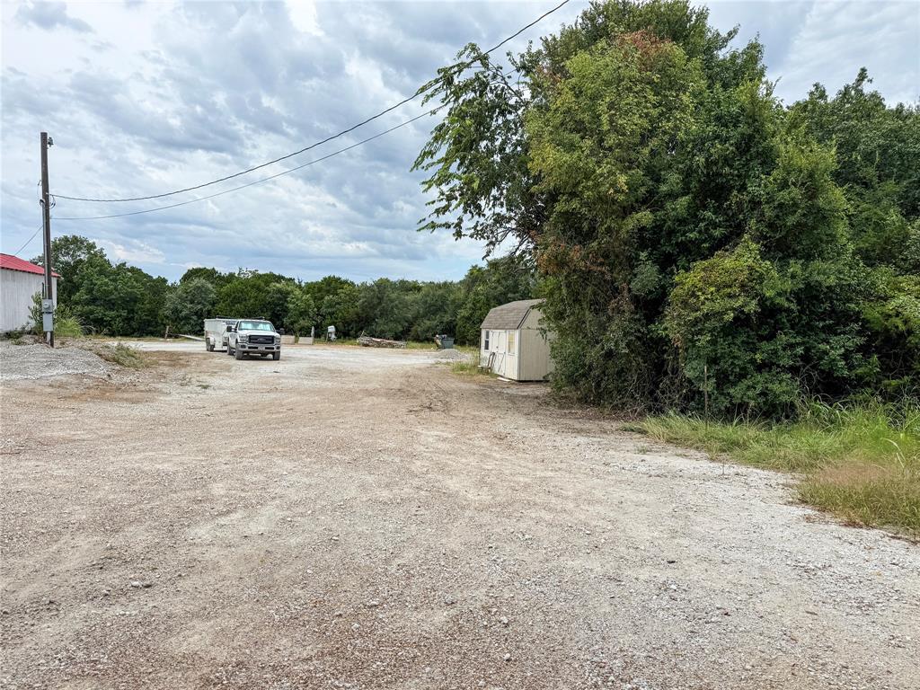 103 Sharon Street Whitney, TX 76692 - Photo 14 of 23 a view of a field with a tree in the background