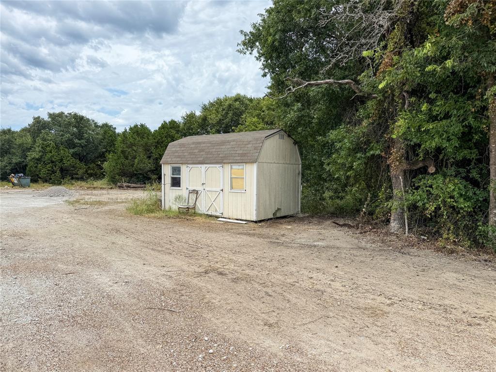 103 Sharon Street Whitney, TX 76692 - Photo 15 of 23 a backyard of a house with lots of green space