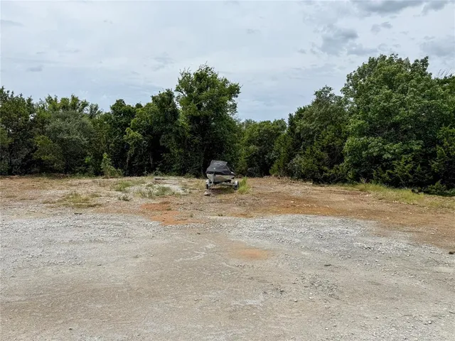 a view of a small house with a yard