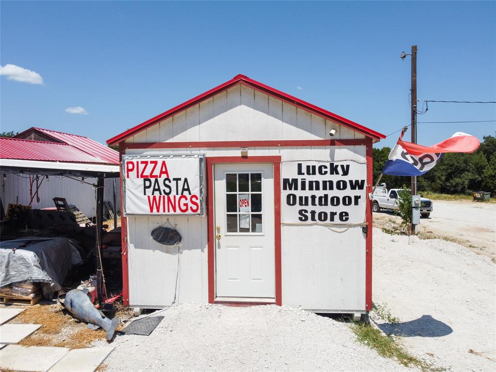 103 Sharon Street Whitney, TX 76692 - Photo 2 of 23 a front view of a building with parking