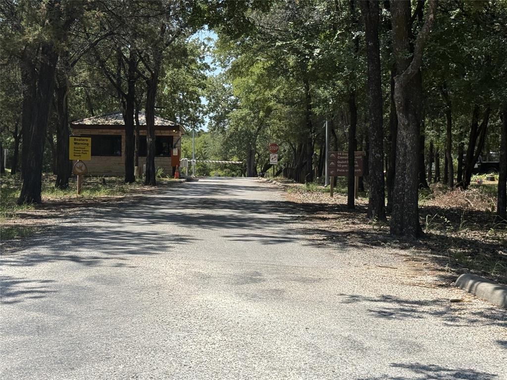 103 Sharon Street Whitney, TX 76692 - Photo 21 of 23 a view of a house with a yard