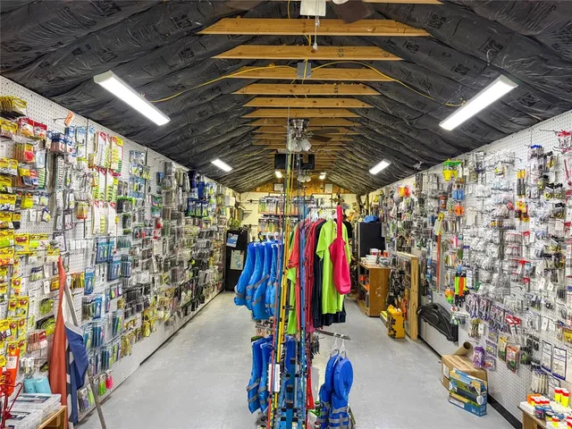 a store room with lots of different colored cloths