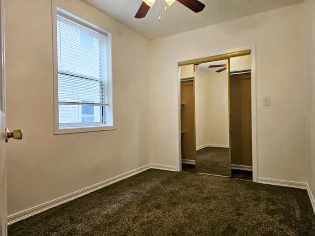 an empty room that has a window in it