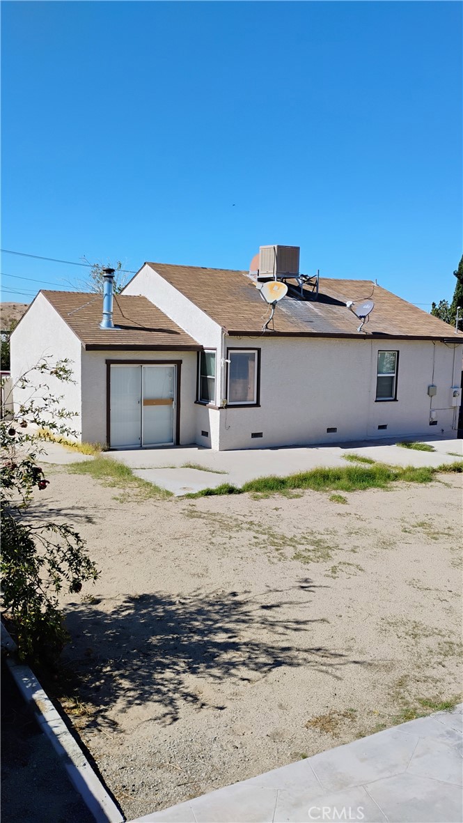 729 Mount Vernon Street Barstow, CA 92311 - Photo 2 of 2 a front view of a house with swimming pool
