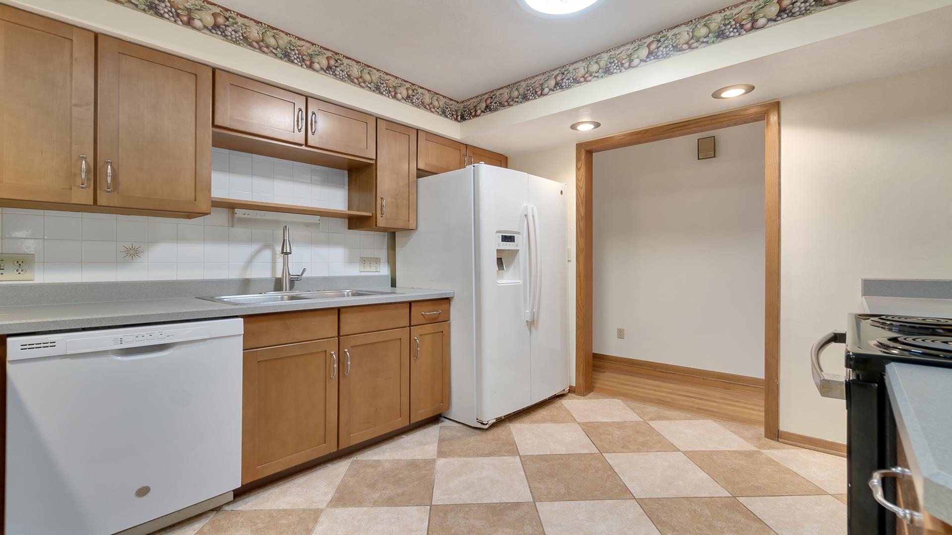 4644 Pepper Drive Rockford, IL 61114 - Photo 17 of 45 a kitchen with stainless steel appliances a refrigerator sink and cabinets