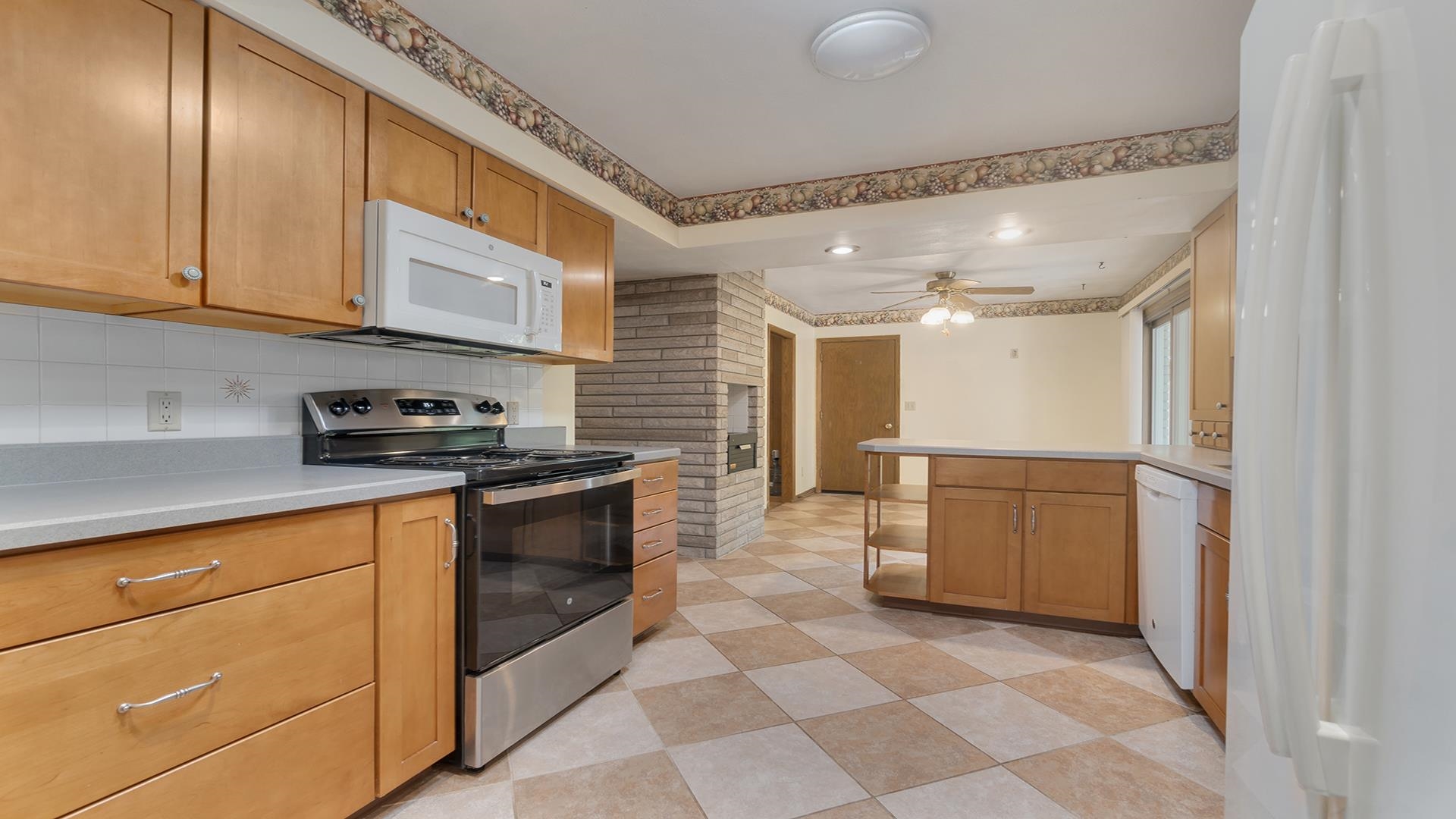 4644 Pepper Drive Rockford, IL 61114 - Photo 18 of 45 a kitchen with stainless steel appliances granite countertop a refrigerator and a sink
