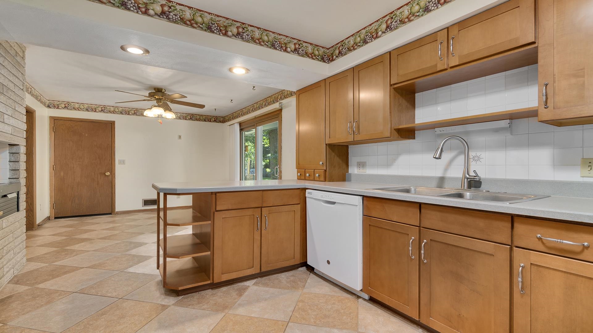 4644 Pepper Drive Rockford, IL 61114 - Photo 19 of 45 a kitchen with stainless steel appliances granite countertop a sink and cabinets