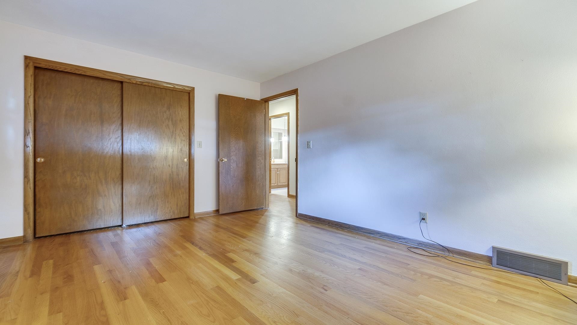 4644 Pepper Drive Rockford, IL 61114 - Photo 26 of 45 a view of an empty room with wooden floor and closet