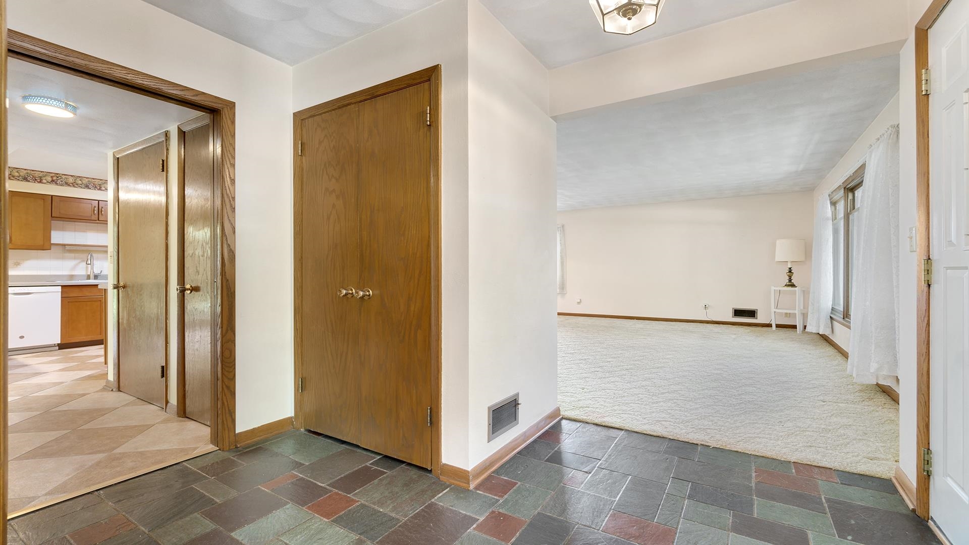 4644 Pepper Drive Rockford, IL 61114 - Photo 5 of 45 a view of a hallway with closet and wooden floor