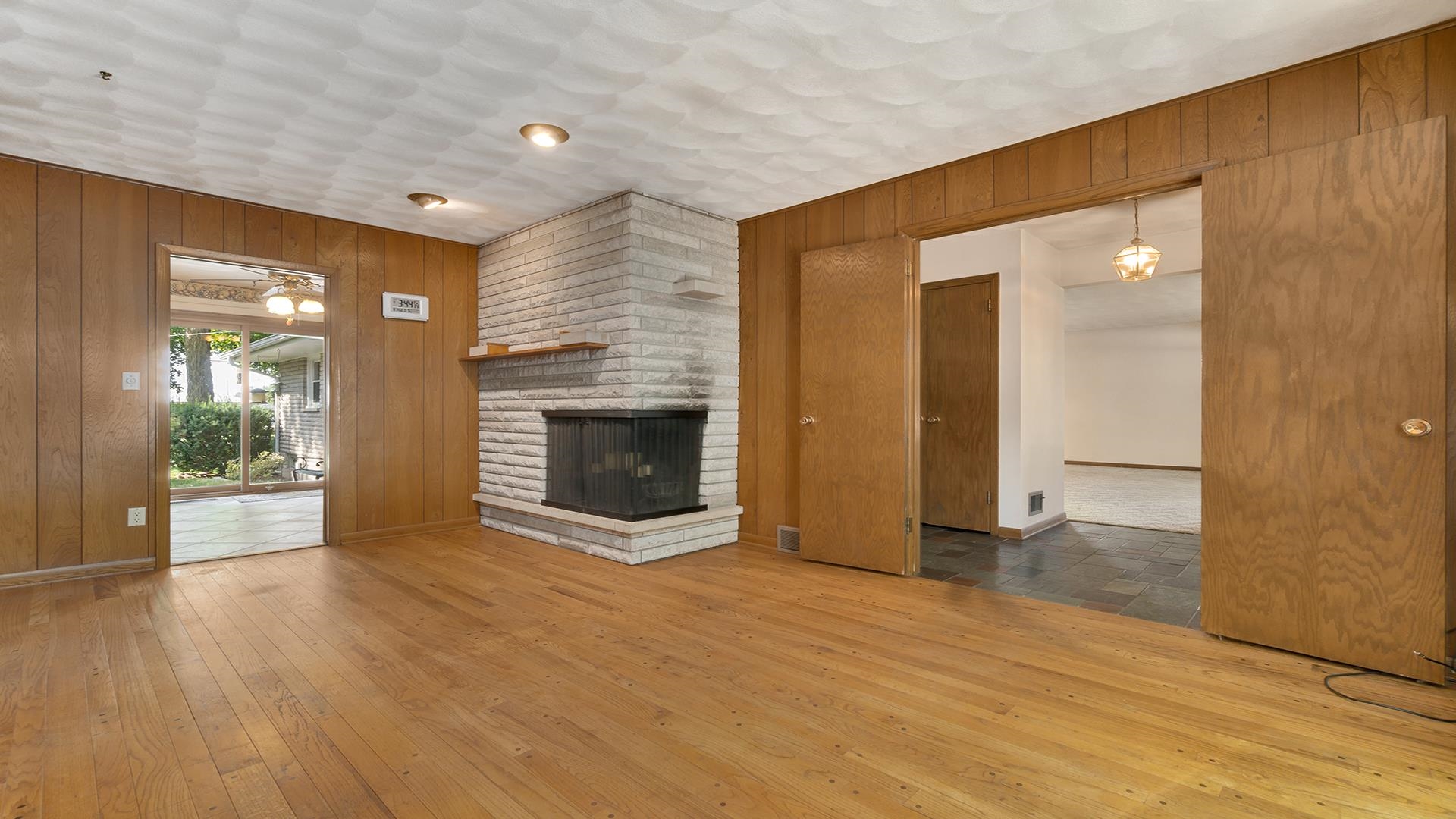 4644 Pepper Drive Rockford, IL 61114 - Photo 10 of 45 a view of a livingroom with wooden floor and a fireplace