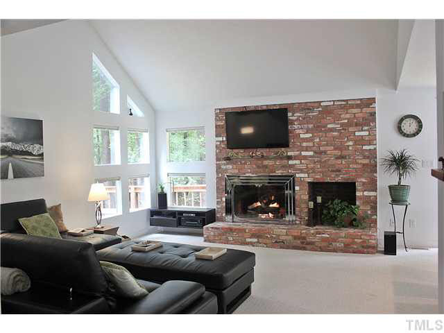 500 Brookfield Road Raleigh, NC 27615 - Photo 25 of 25 Bright, open and airy floor plan. Beautiful views of private lot from all the custom windows. Den/Family/Great Room