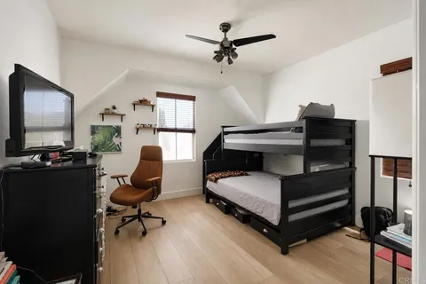 a bedroom with furniture and a window