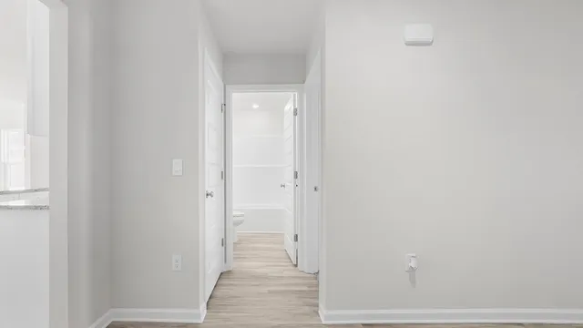 a view of a bathroom from the hallway
