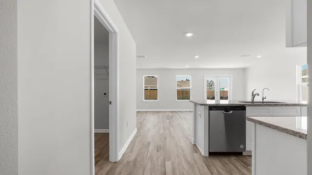 a view of a room with wooden floor