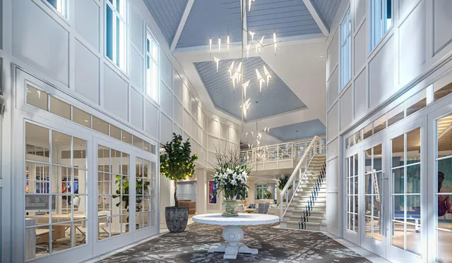 a kitchen with stainless steel appliances granite countertop a sink a stove a refrigerator cabinets and chairs