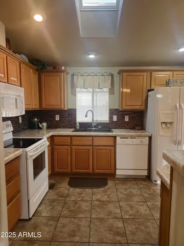 a view of a sink and a window