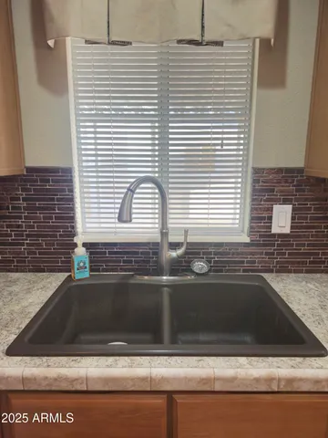 a kitchen with stainless steel appliances granite countertop a refrigerator sink and cabinets