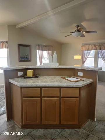 a kitchen with cabinets and a stove top oven