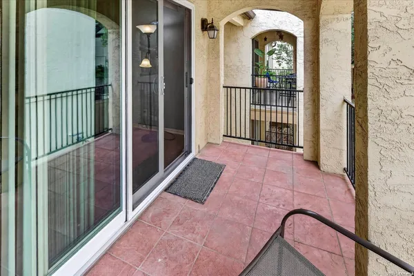 a view of a balcony with door