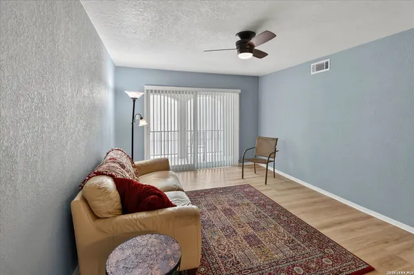 a living room with furniture and a rug
