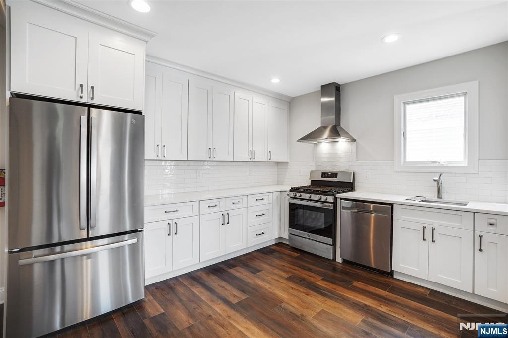 79 Mill Street, Unit 79B Bloomfield, NJ 07003 - Photo 3 of 12 a kitchen with stainless steel appliances a refrigerator sink and cabinets