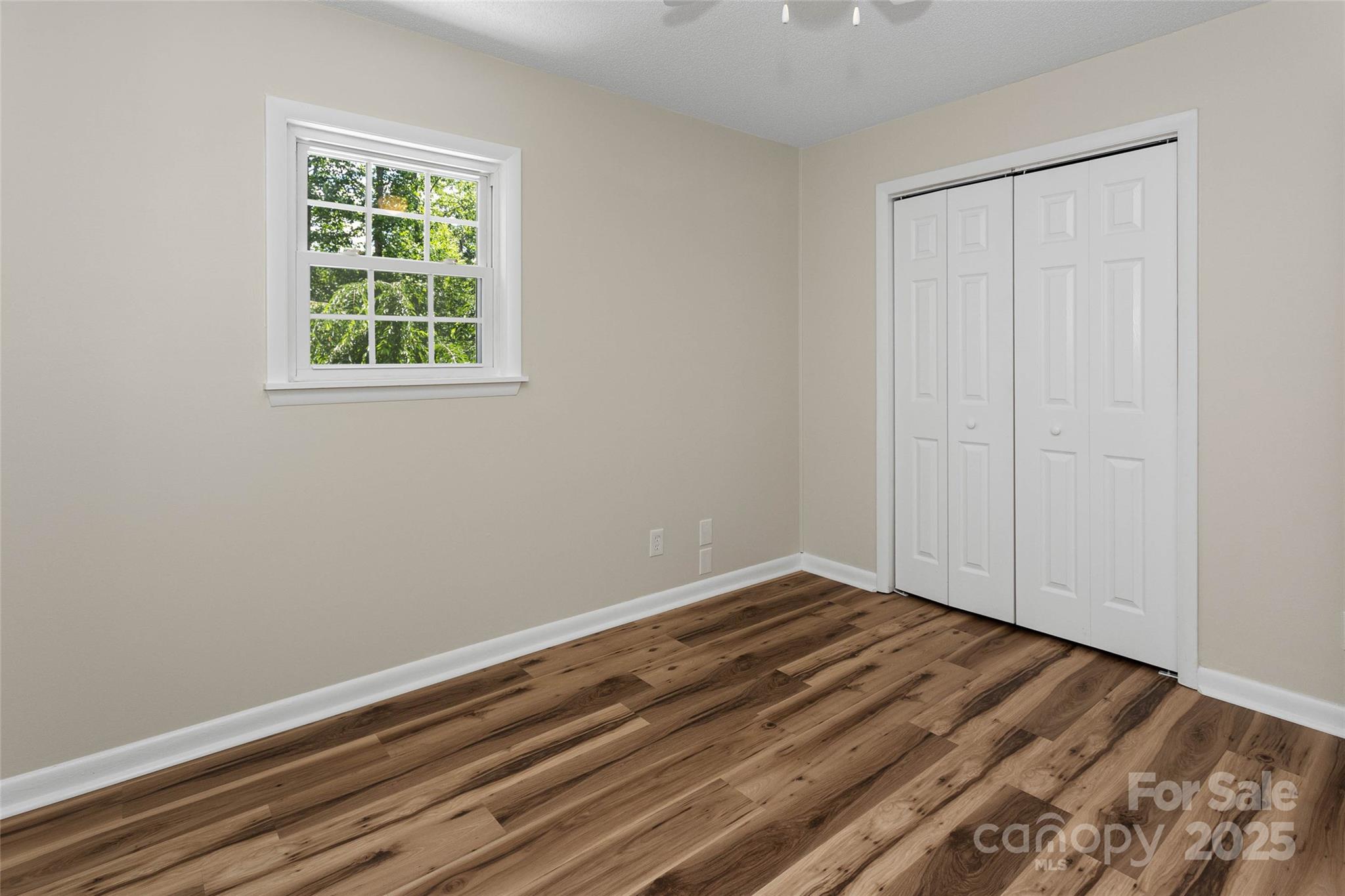 233 Youngs Cove Road Candler, NC 28715 - Photo 18 of 47 an empty room with a window