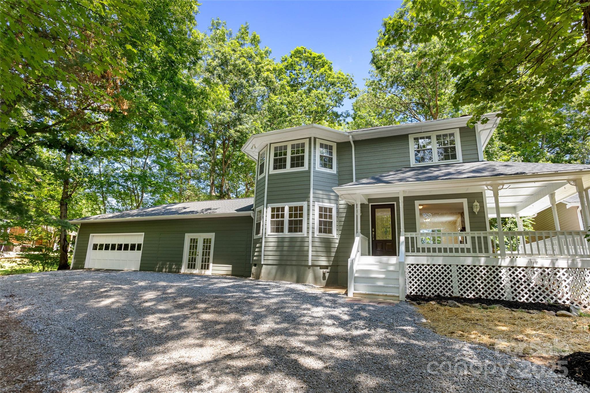 233 Youngs Cove Road Candler, NC 28715 - Photo 2 of 47 a view of a house with a yard and plants