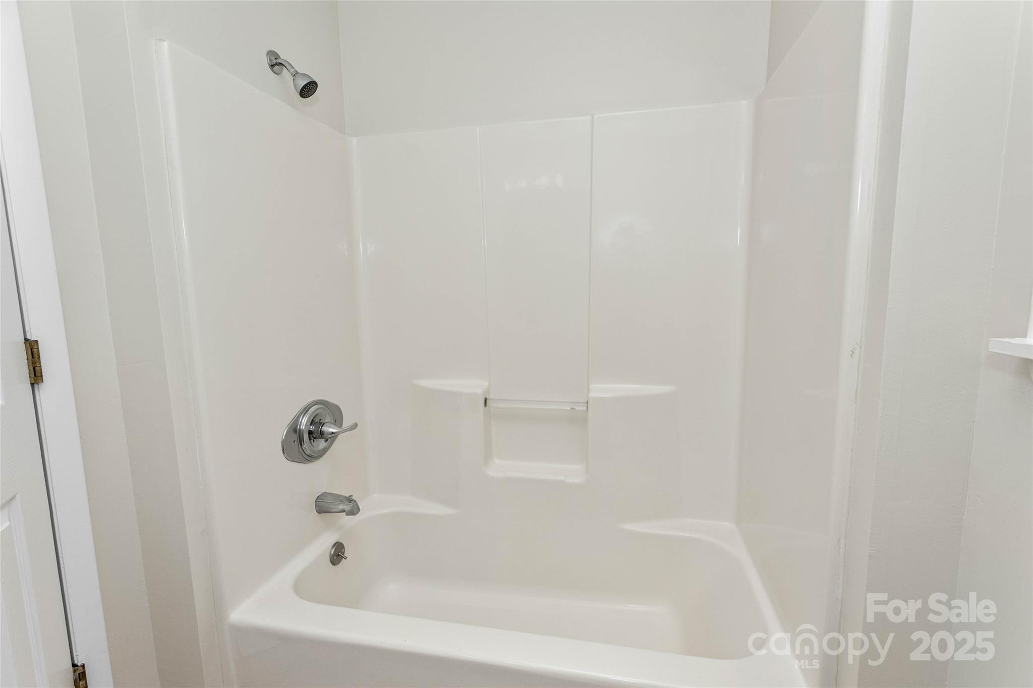 233 Youngs Cove Road Candler, NC 28715 - Photo 21 of 47 a bathroom with a bathtub