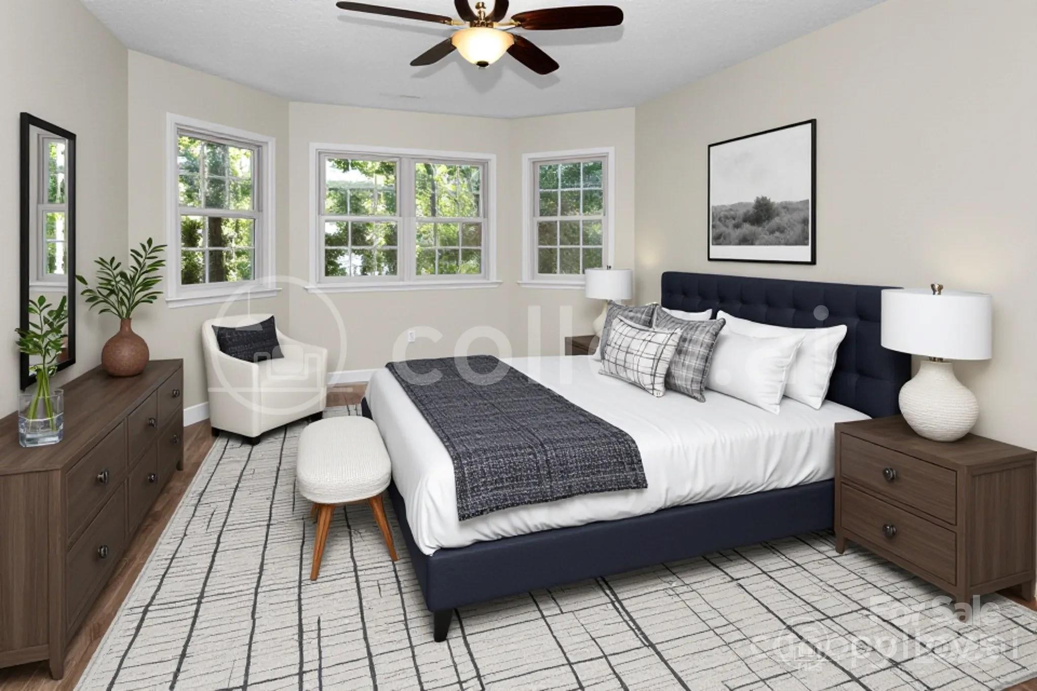 233 Youngs Cove Road Candler, NC 28715 - Photo 24 of 47 a bedroom with a bed and a large window