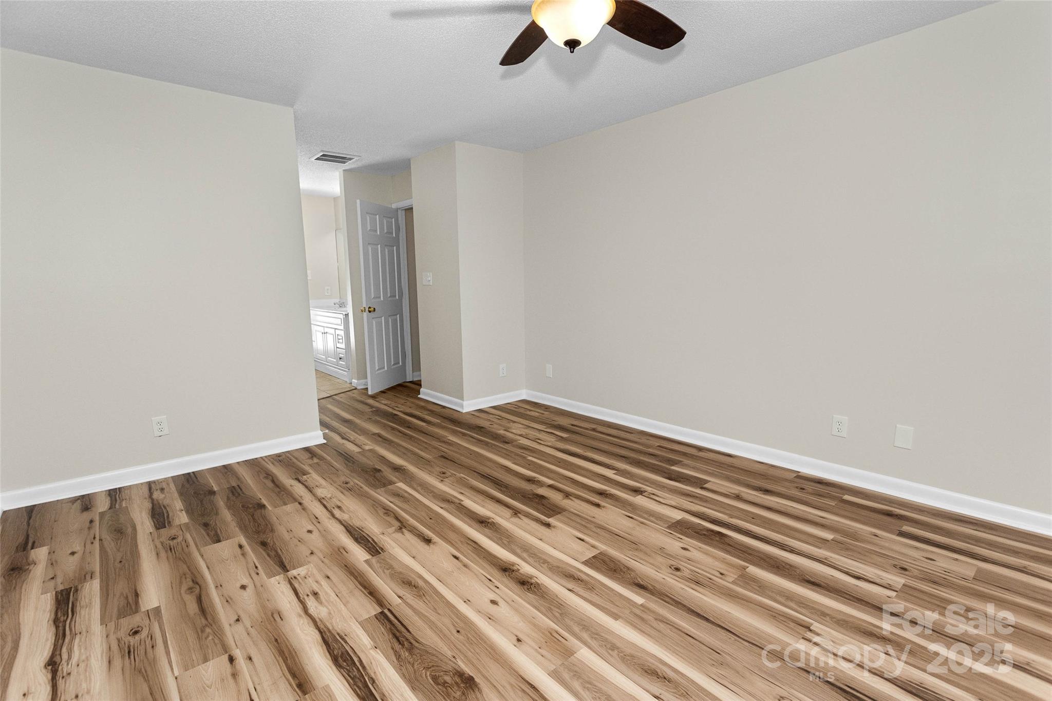 233 Youngs Cove Road Candler, NC 28715 - Photo 25 of 47 wooden floor and a chandelier fan view