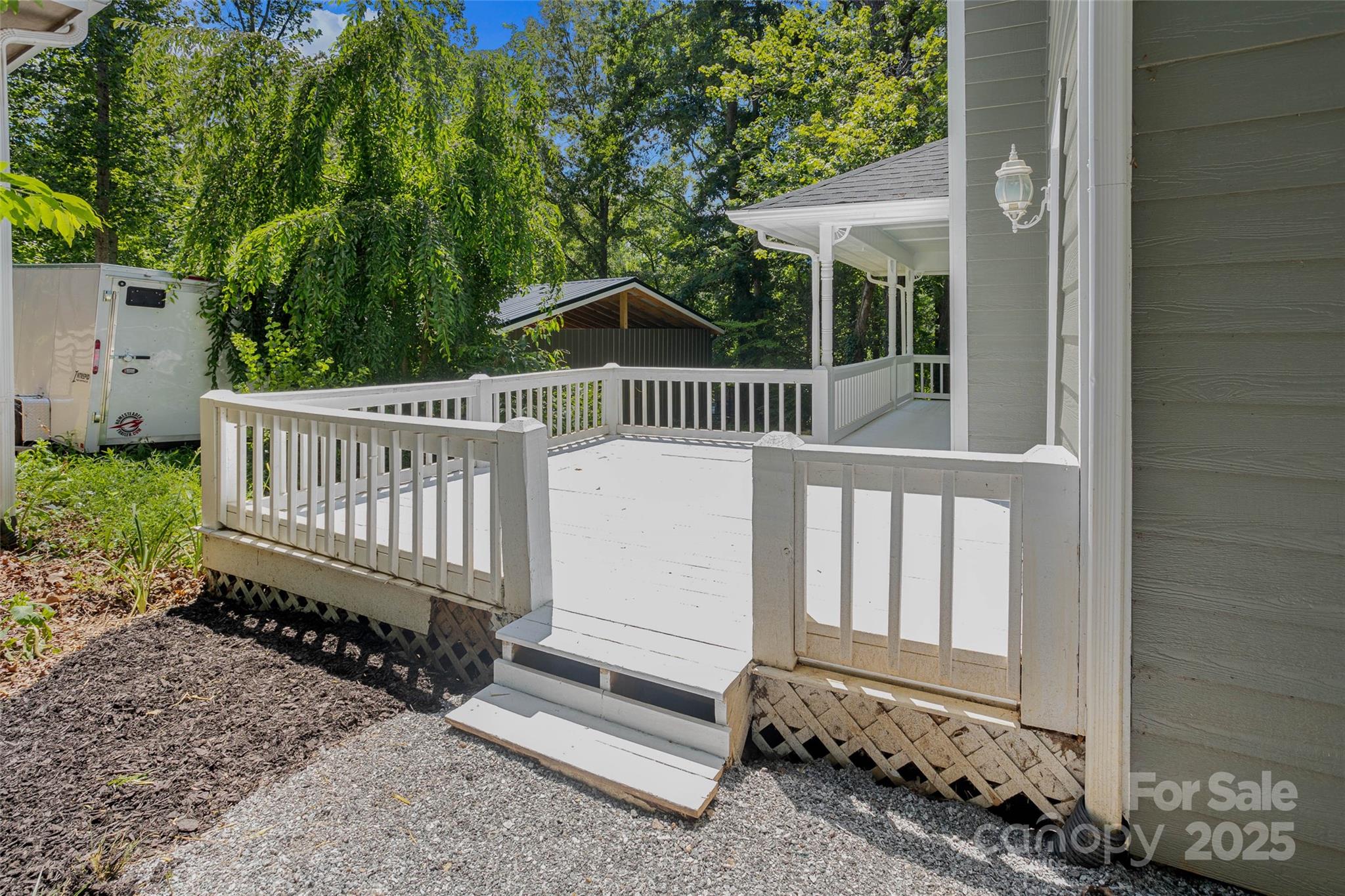 233 Youngs Cove Road Candler, NC 28715 - Photo 31 of 47 a view of a deck with a fence