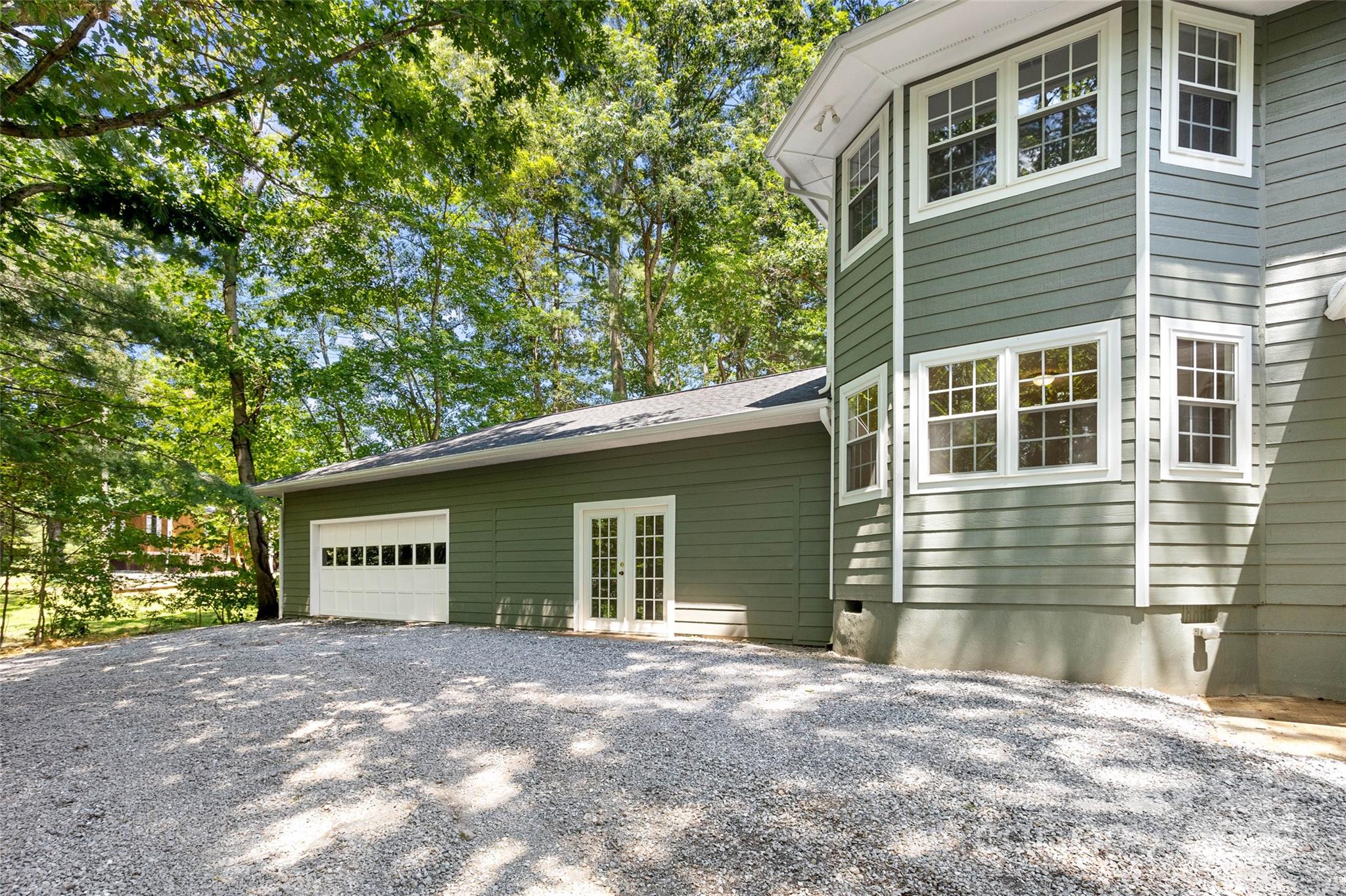233 Youngs Cove Road Candler, NC 28715 - Photo 47 of 47 a view of a house with a yard and garage
